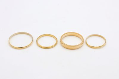 a set of five gold wedding rings