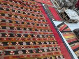 many rugs that are on the floor in the room