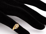 an image of a close up of a person ' s hand with a ring on it ' s finger