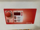an image of a red and white control panel on a machine