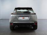 the rear end of a silver suv parked in a room