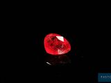 a red diamond on a black surface