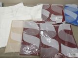 many different types of t - shirts on the table