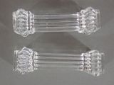 two clear glass candlesticks sitting on a table