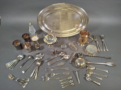 a lot of silver and silverware on a table