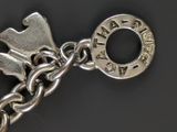 a keychain with a chain attached to it on a black surface