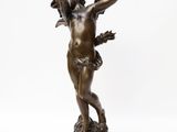 an image of a bronze statue of a man holding a sword