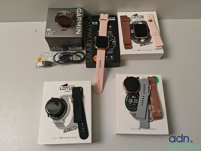 a box of watches and a watch on a table