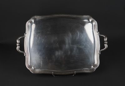 a silver tray with handles and handles on a black background