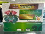 display of a pokemon figure in a store with a box on the table