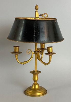 a lamp that has a black shade on top of it