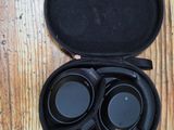 a pair of headphones in a case on a wooden table