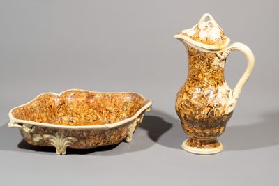 two vases and a bowl on the table