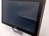 a tablet computer that is sitting on a stand