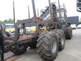 a tractor that is parked in a parking lot