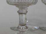 two empty wine glasses sitting on a table