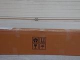 a cardboard box sitting on the floor in front of a garage door