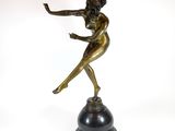 an image of a bronze statue of a woman on a black base
