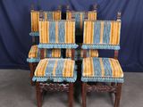 four chairs with striped upholstered upholstered cushions