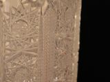 a close up of a glass vase on a table