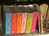 a lot of books that are sitting on the ground