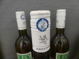 three bottles of wine that are sitting on a table