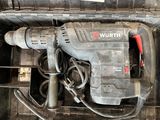 a drill that is sitting in a tool box