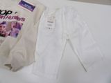 a white shirt and pants that are on a table