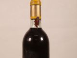 a bottle of wine that is sitting on a table