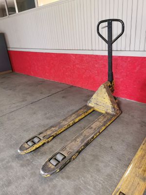 a pallet that is sitting on the ground in front of a building