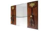 a mirror on the wall with a glass shelf underneath it
