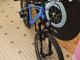 a bicycle that is parked in front of a sign