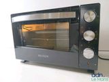 a black toaster oven sitting on a white table