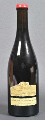 a black bottle with a red top and a yellow label