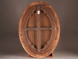 an oval wooden table with a cross on the top and a cross on the bottom