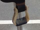 a close up of a shoe on a parking meter