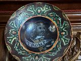 a decorative plate with a picture of a man on it