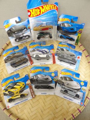 a lot of hot wheels cars on the table