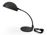 the black desk lamp is on a white surface with a cord