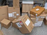 a pile of boxes sitting on the ground next to each other