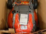 a box with a lawn mower inside of it
