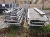 several pieces of metal are stacked on top of each other in a yard