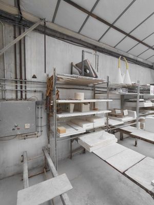 a room that has many shelves and tables in it