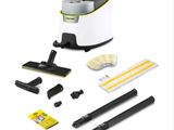 un aspirateur blanc et noir avec des produits d'entretien sur fond blanc