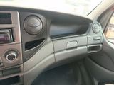 a dashboard of a car with a radio and a steering wheel