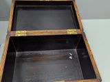 a small wooden box sitting on top of a table