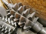 a close up of a machine that has gears attached to it