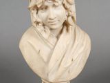 marble bust of a woman with a veil on her head