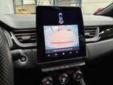 the dashboard of a car with a gps device in the center of it