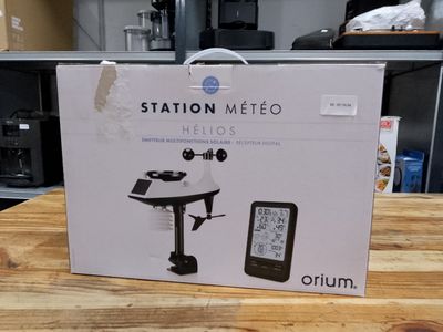 a box that is sitting on a table with a clock on it
